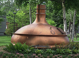 A copper cauldron objet d’art for brewing beer